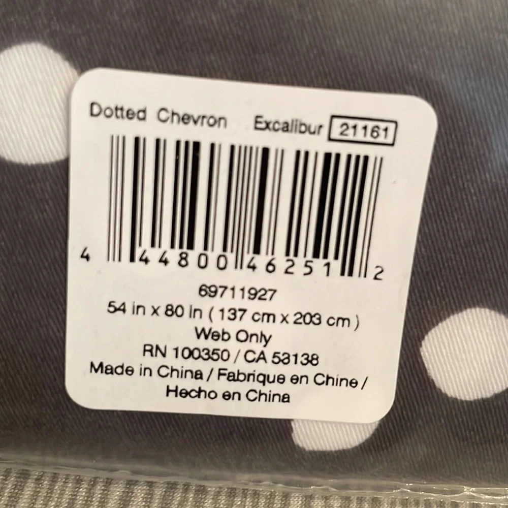 Shower curtain dark gray with white dotted chevron pattern. Great accent